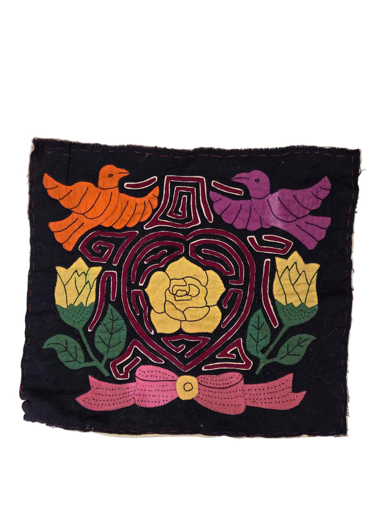 Embroidered patch with birds, flowers, and a heart design on a black background